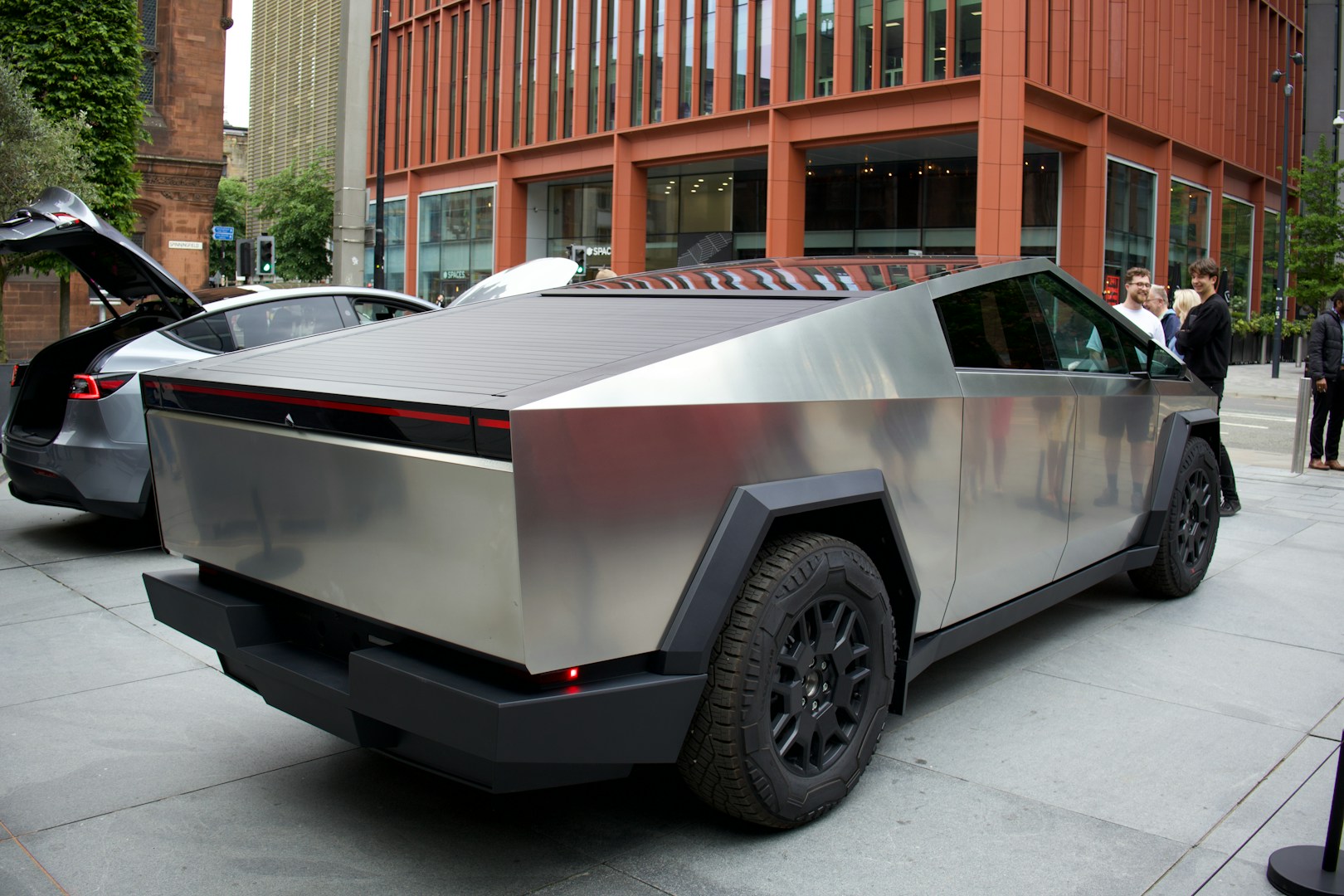 a futuristic car is parked on the side of the street